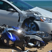 A biker speeding south on A1A in Flagler Beach struck a two-door Pontiac GT