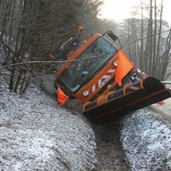 Truck mounted Snow blower slipped into the side of the road